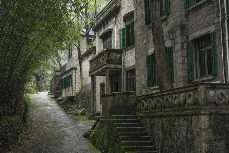 A row of old stone summer villas along a mountain lane at Moganshan